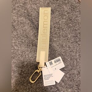 Lululemon NeverLost Gray Sparkle Keychain with Gold Accents